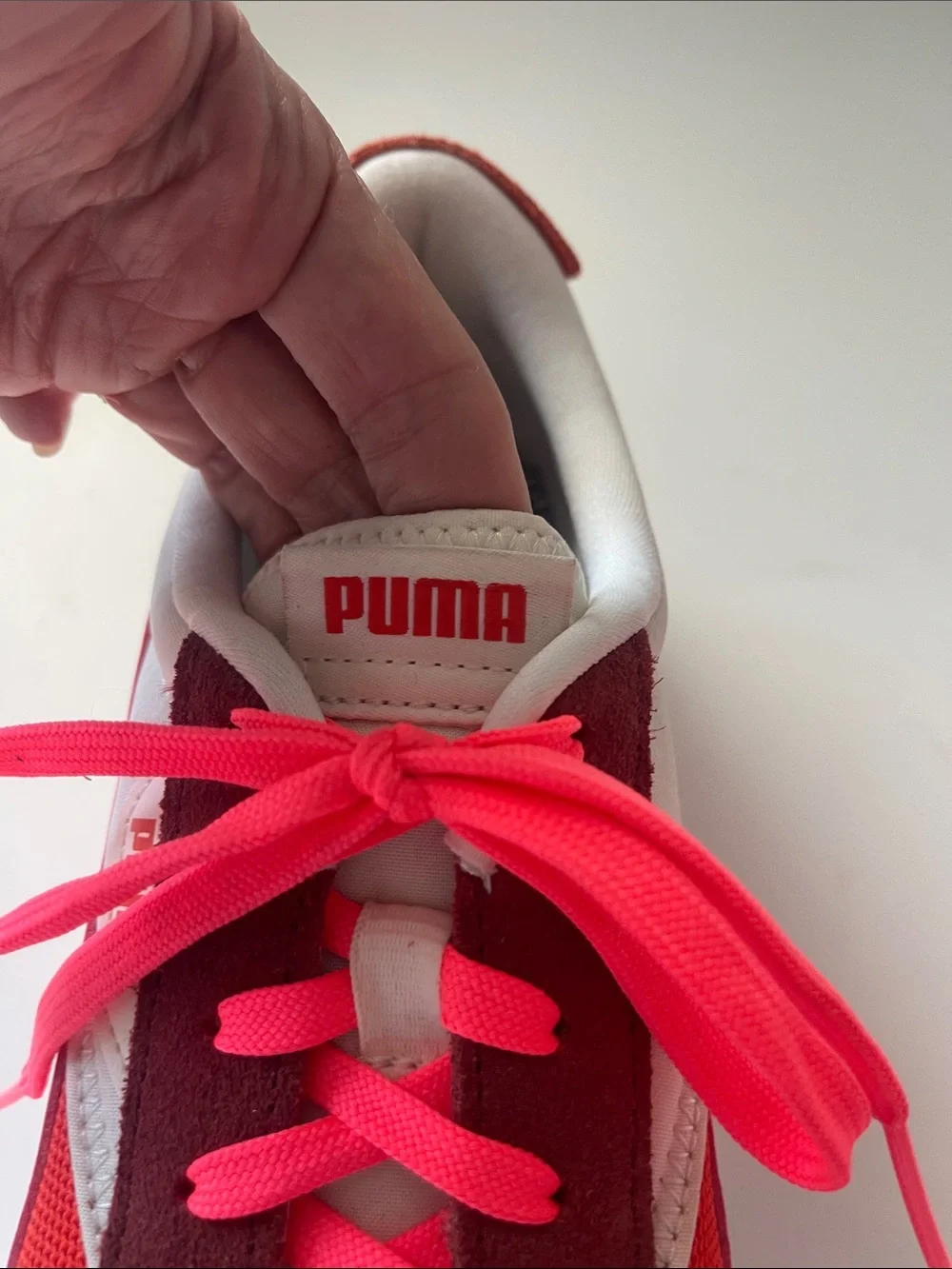 Puma Maroon, tomato red, & hot pinkish-orange accents. Pink Retro Runner Sneaker